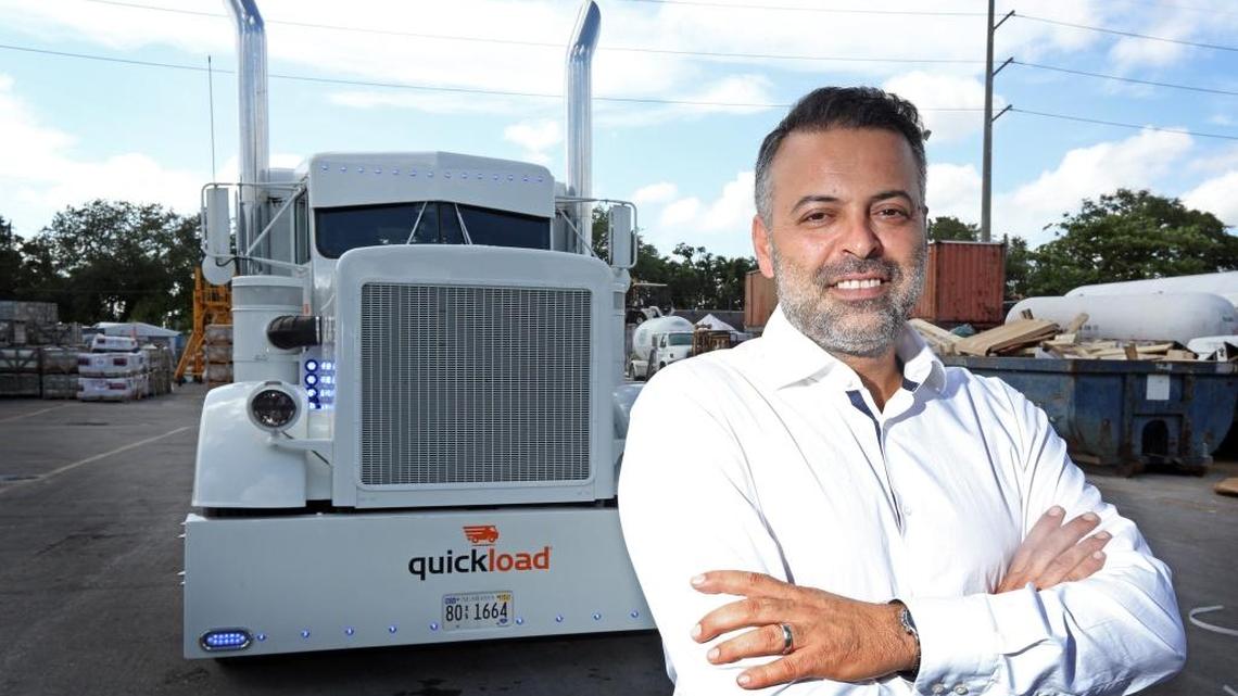 BOS Group CEO/Founder Ozan Baran at his Allapattah warehouse in front of one of his new ‘Quickload’ trucks.