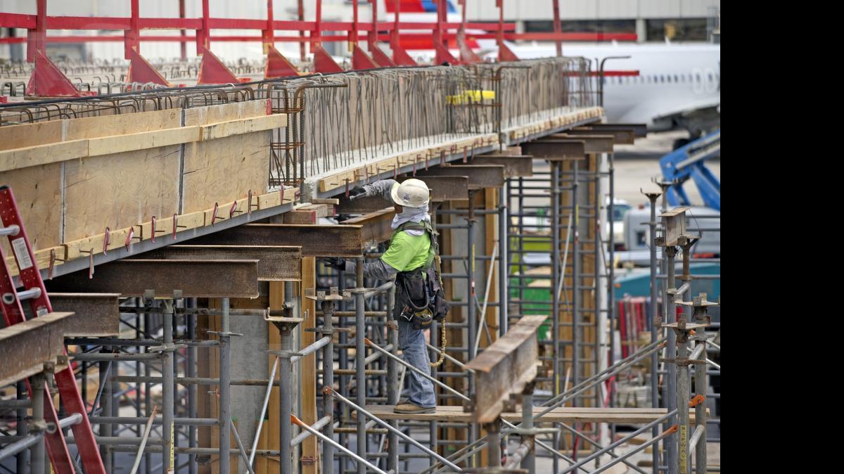 
A construction worker is on the sight of the new baggage building for JetBlue on May 29, 2015. JetBlue is rapidly expanding its presence at Fort Lauderdale-Hollywood International Airport.
