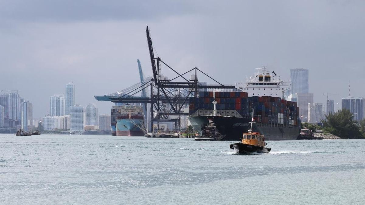 A cargo ship passes in Biscayne Bay, where the $205 million Deep Dredge project at PortMiami was completed in September. In a generally tough year for export-import trade, PortMiami had a good year in 2015.