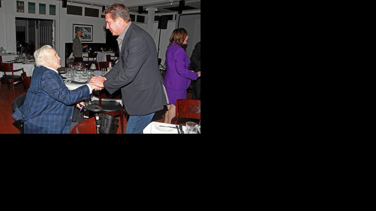 
Don Shula with former Miami Dolphins quarterback Dan Marino at Shula’s Steak House in Miami Lakes. They are at an event to commemorate 25 years of Shula’s Restaurants on Nov. 5, 2014. 
