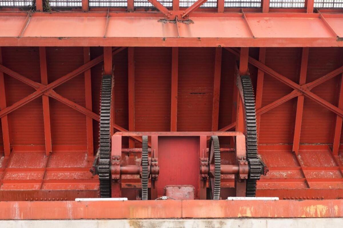One of the seven drawbridges the Antillean Marine cargo boats pass by in the Miami Canal opens on Thurs., June 29, 2017.