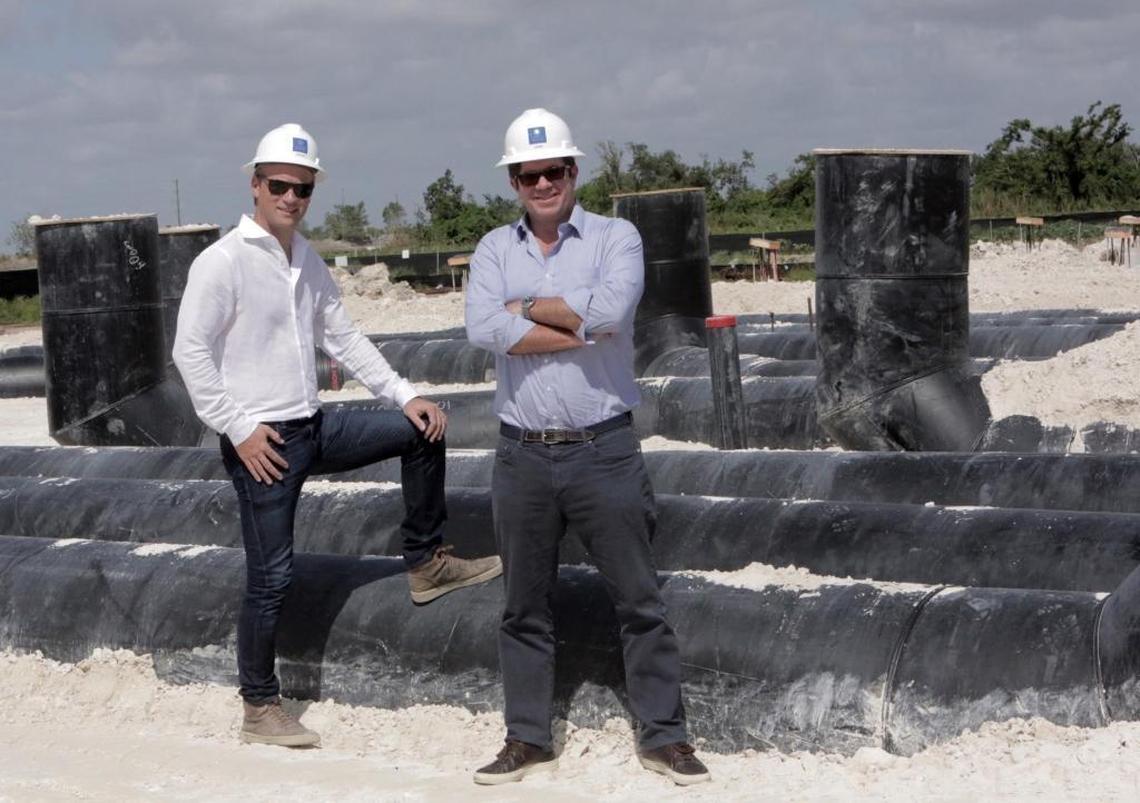 CEO and founder Johan Andreassen (left) and CFO José Prado, who heads up the Miami operation pose for a photo standing near pipes that are currently being installed at the site of the "Blue House" in South Miami-Dade County. Atlantic Sapphire, the world leader in land-raised salmon farming, is building a massive construction project. This is a salmon farm in the works like no other in Florida.