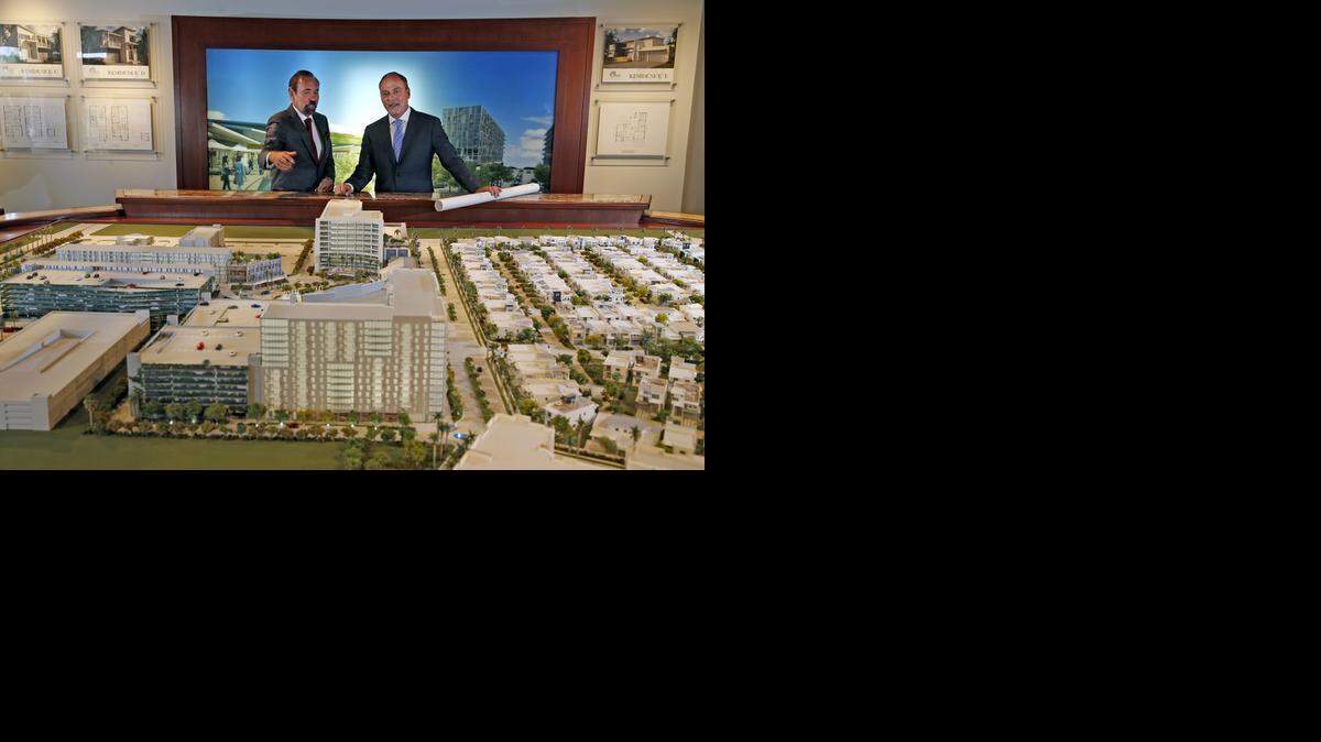 
Jorge Pérez chairman and CEO of Related Group, left, with Steve Patterson, president of Related Development, at the sales center for CityPlace Doral.


