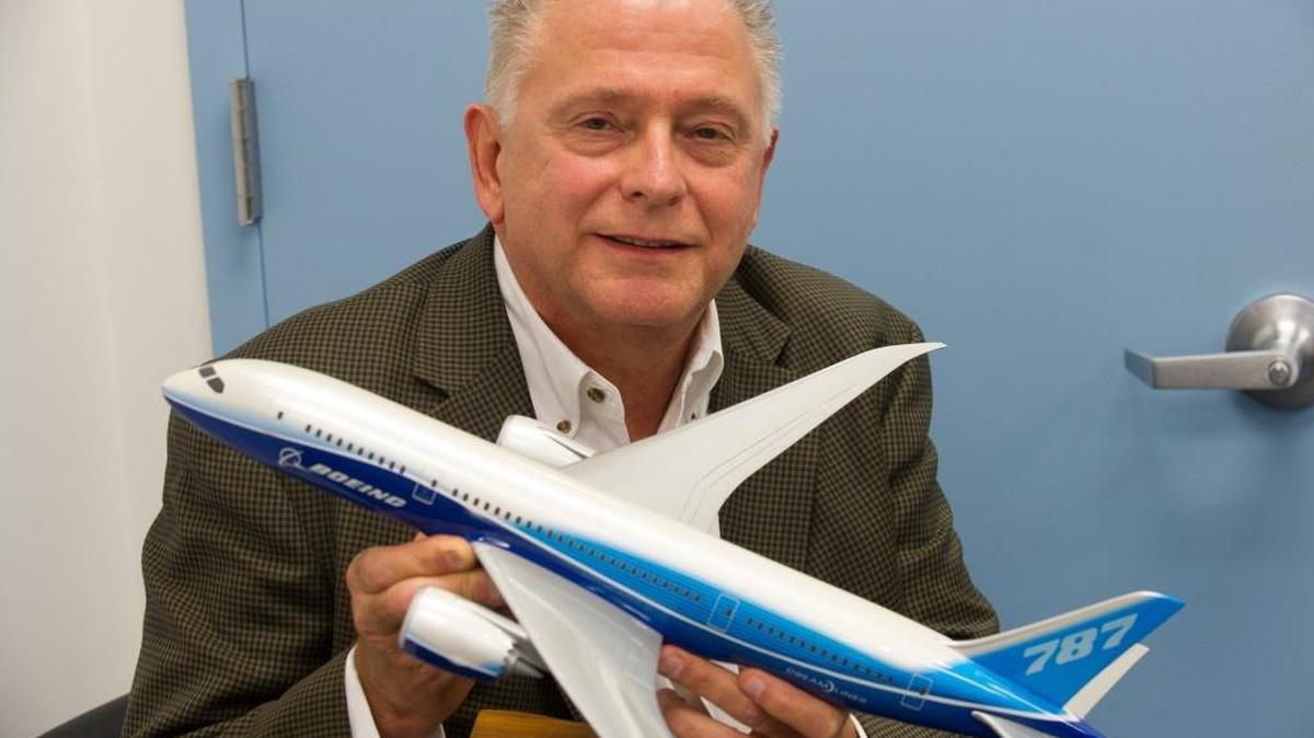 
Martin Schaaf, manager of the Boeing Flight Services Miami Campus, holds a model of a 787 Dreamliner. The Miami training center has 24 flight simulators.
