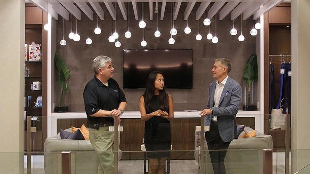 Amico’s CEO, Adam Mopsick, talks with his team Codi Funakoshi, operations manager, and Mike Denisar, senior project manager, left, in the newly renovated spa on Williams Island.
