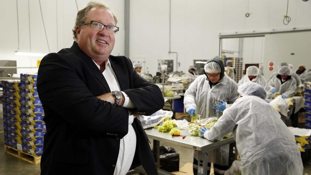 Dave Bouchard, president of Flagler Global Logistics at the South Florida Logistics Center near Miami International Airport. Workers nearby pack grapes. (More photos: MiamiHerald.com.)