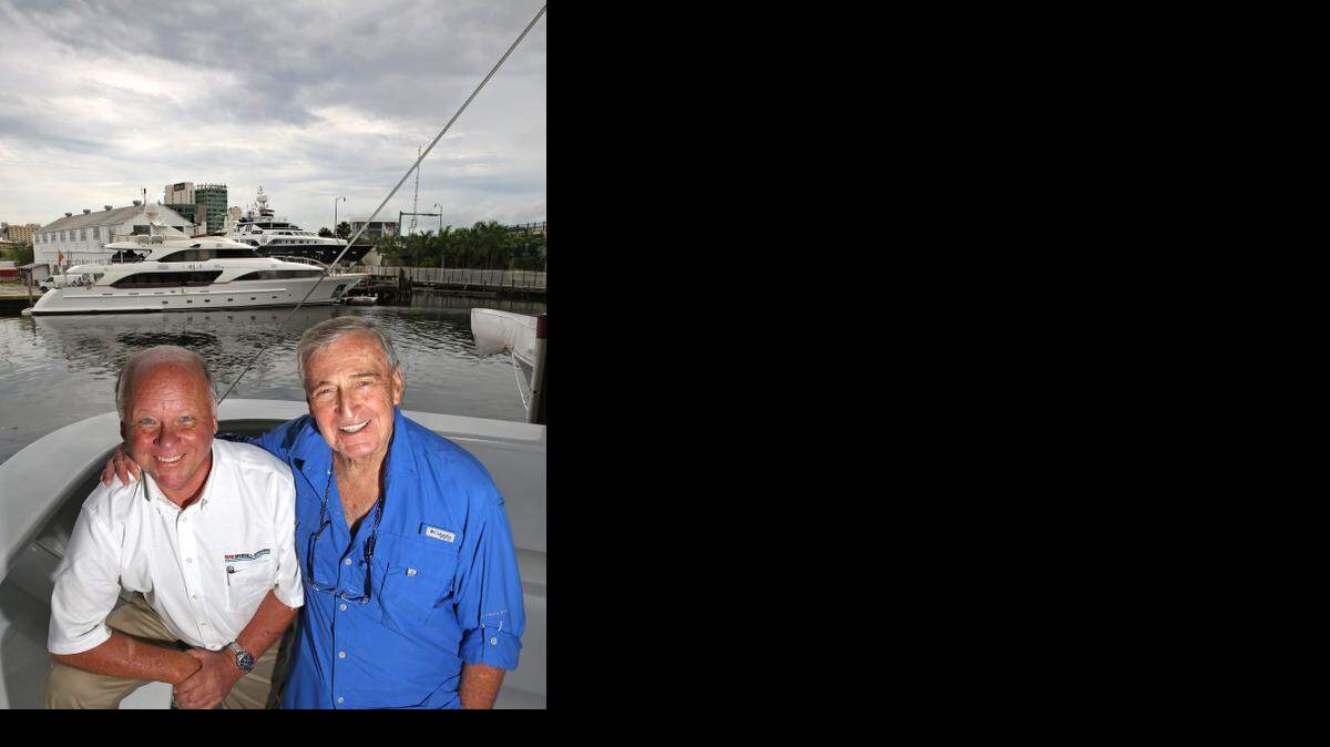 
John Spencer, left, and Rahmi M. Koç, at RMK Merrill-Stevens boatyard. Koç is a Turkish industrialist and philanthropist who last year bought the boatyard, one of the oldest businesses in Florida. Spencer is the CEO and a minority owner. 
