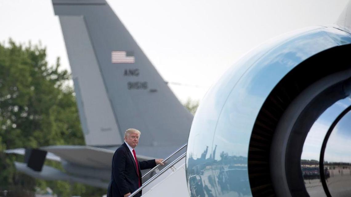 President Donald Trump boards Air Force One at General Mitchell International Airport in Milwaukee, Tuesday, June 13, 2017, to travel to Andrews Air Force Base, Md.
