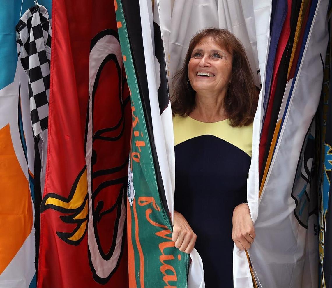Barbara Dabney is photographed on Monday, June 19, 2017 among the many flags sold at Freedom Flag & Banner Company in North Miami, Florida.