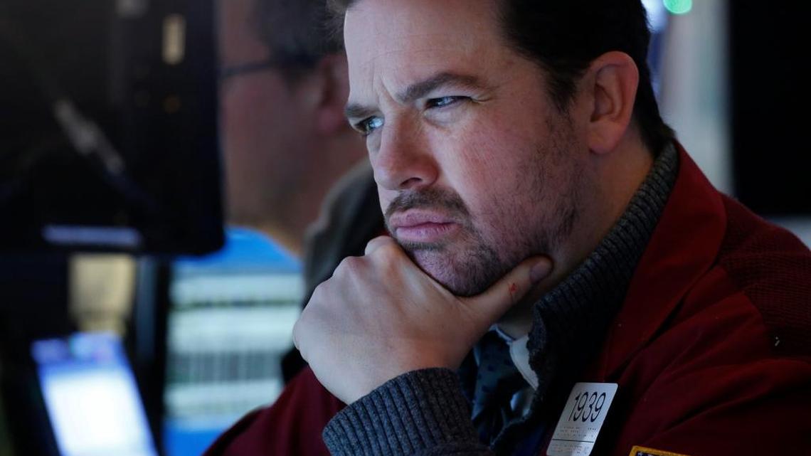 Stock trader Chris Lotito studies a computer screen at the New York Stock Exchange on Jan. 2. In the business world, many use digital devices 8 to 10 hours daily, including computers, tablets, and cell phones.