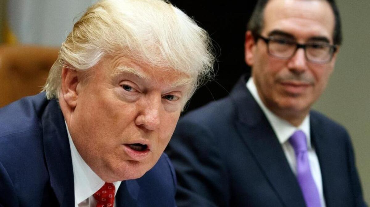 Treasury Secretary Steven Mnuchin listens as President Donald Trump speaks during a meeting on the federal budget in the White House in Washington on Feb. 22. Tax plans being considered now could severely curtail the incentives for charitable donations and therefore put many charities at risk, says John R. Anzivino, a principal in charge of the estate, trust and exempt organization practice of Kaufman Rossin.