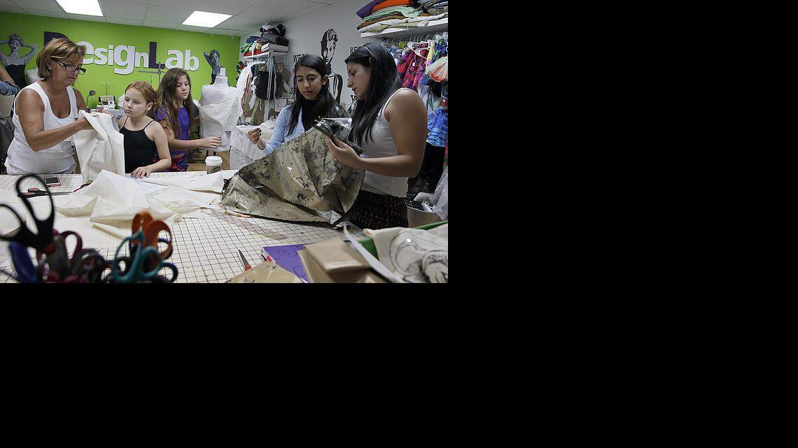 
Trend setters: Angie Cohen, left, founder/creative director instructs her students during a fashion class at DesignLab.
