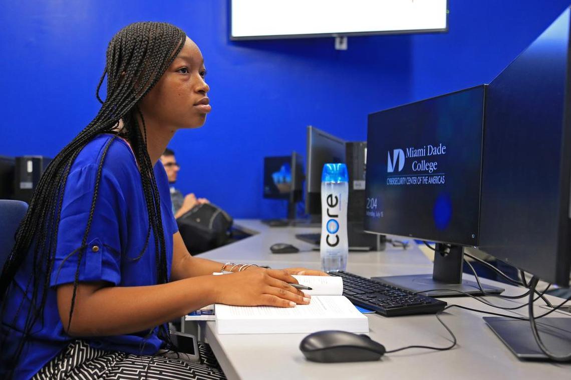 Ambrel Brown, 20, a student at the Cybersecurity Center of the Americas at Miami Dade College - Wolfson Campus in Downtown Miami listens to the instructor during a class on Monday, July 15, 2019.