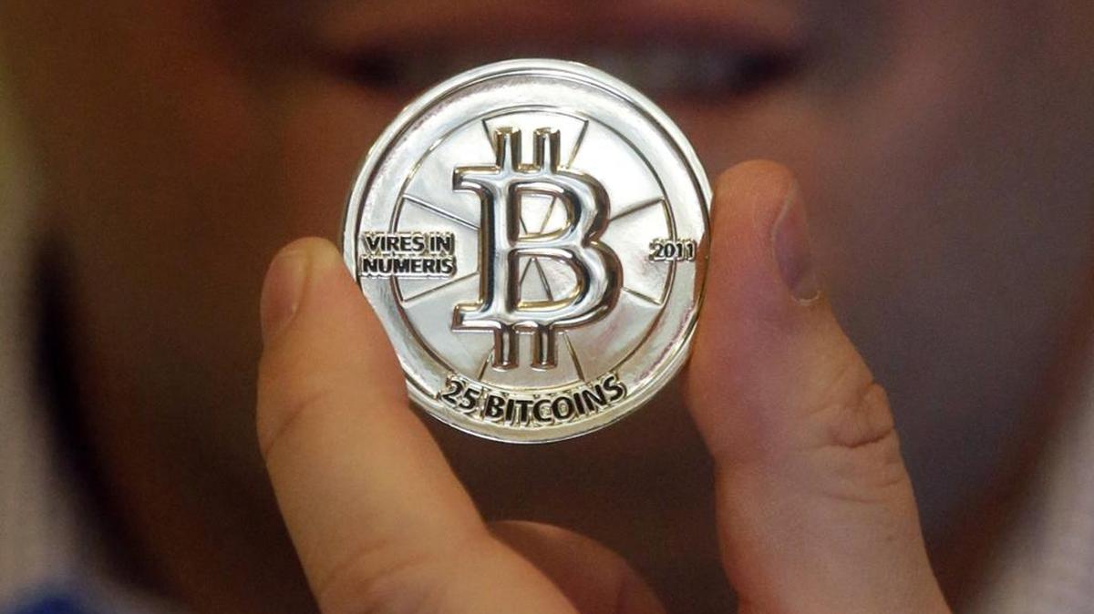 A 25 Bitcoin token. Bitcoin is an online currency that allows people to make one-to-one transactions, buy goods and services and exchange money across borders without involving banks, credit card issuers or other third parties.