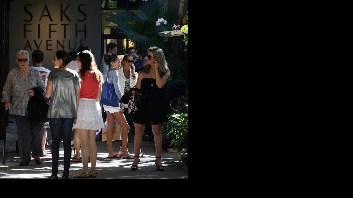 BAL HARBOUR SCENE: Shoppers stroll during last-minute holiday shopping in December. Bal Harbour Shops has recently unveiled several newly designed or expanded stores, including those for Chloé, Bulgari, Intermix and J.W. Cooper., and added The Webster and Buccellati. In 2015, Dsquared2 and Tomas Maier are among the boutiques expected to open.