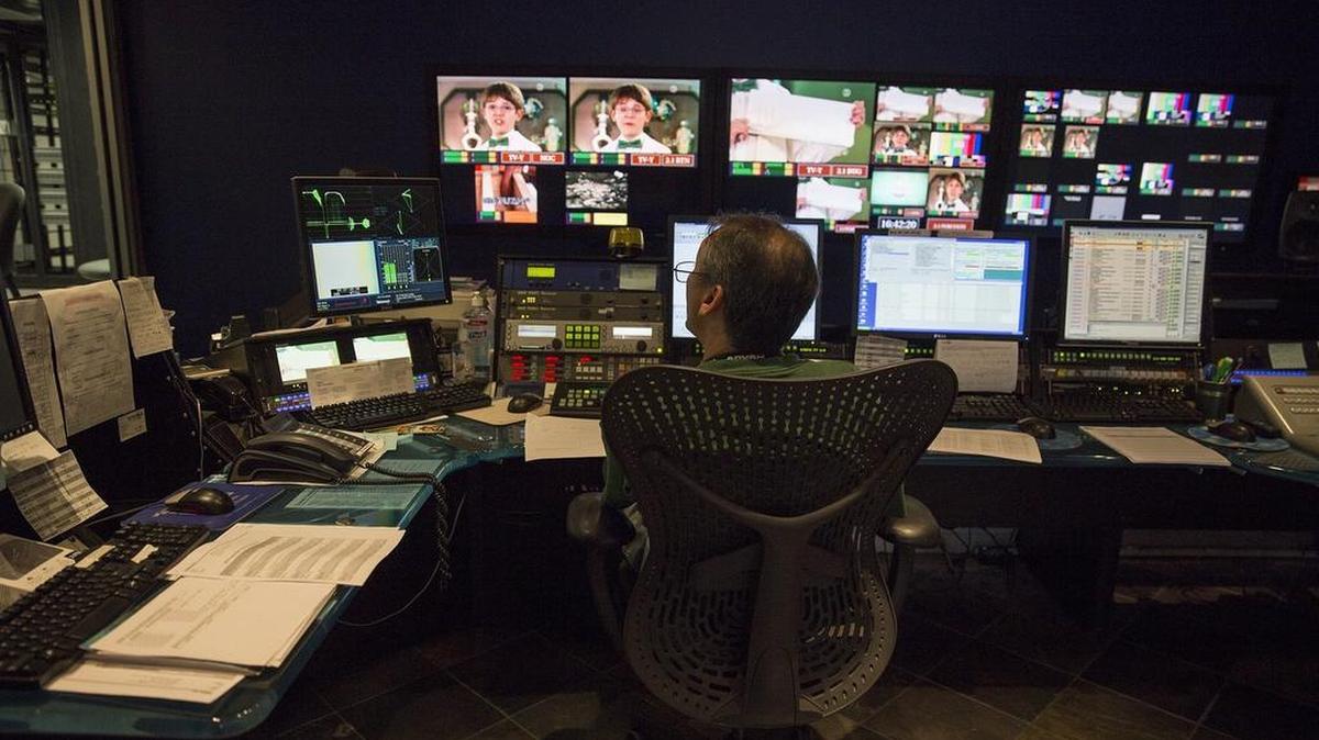 
Dave Fahey operates the master control room at the WPBT Channel 2 studios in North Miami on Aug. 3, 2015. 
