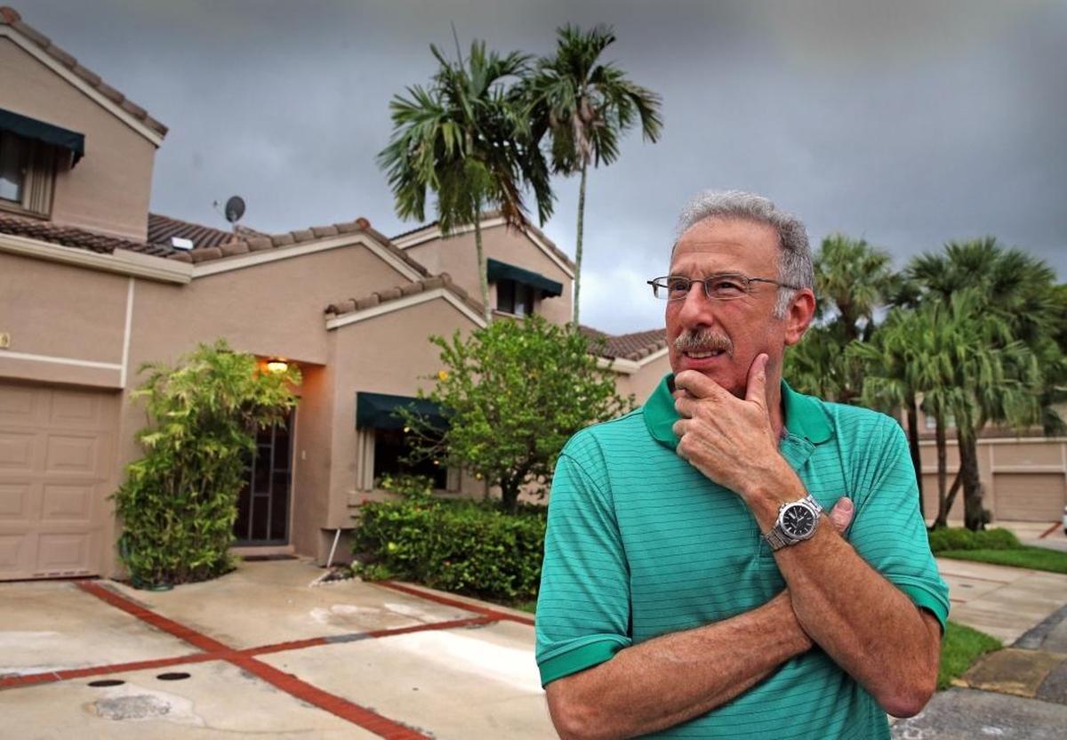 Jay Pellis at his Coral Springs home, which is insured by Heritage Property & Casualty. He’s among the South Florida residents who left Citizens for a takeout company. Now he says he regrets the change because he isn’t really sure that Heritage will cover his claims.