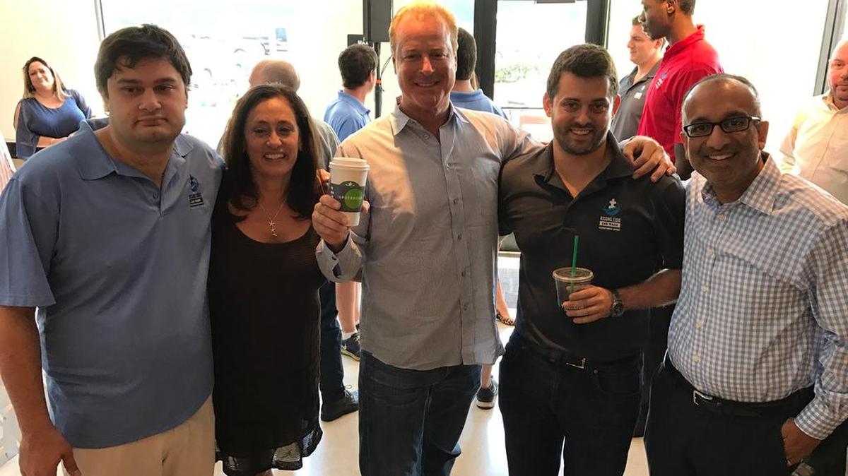 From left, Andrew D’Eri, Donna D’Eri, John D’Eri, Tom D’Eri, and Rajiv Chandrasekaran of Starbucks. They were gathered Wednesday at a Deerfield Beach Starbucks to celebrate ‘Employing the Full Spectrum,’ part of the coffee chain’s new ‘Upstanders’ series.