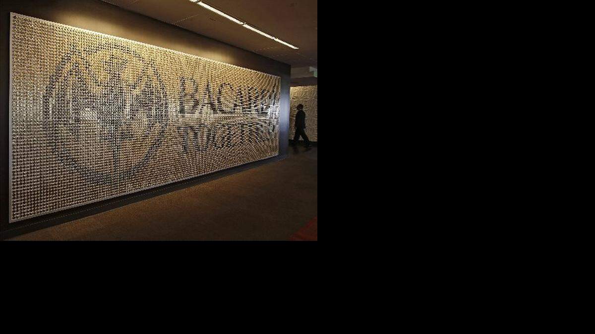 
Art is displayed throughout the hallways and offices of Bacardi's corporate Gables office. Pictured is a piece made of thousands of bottle caps. Downtown Coral Gables has 4.5 million square feet of office space within minutes from the airport and downtown Miami's financial center. It has become a center for many businesses to locate their offices. 
