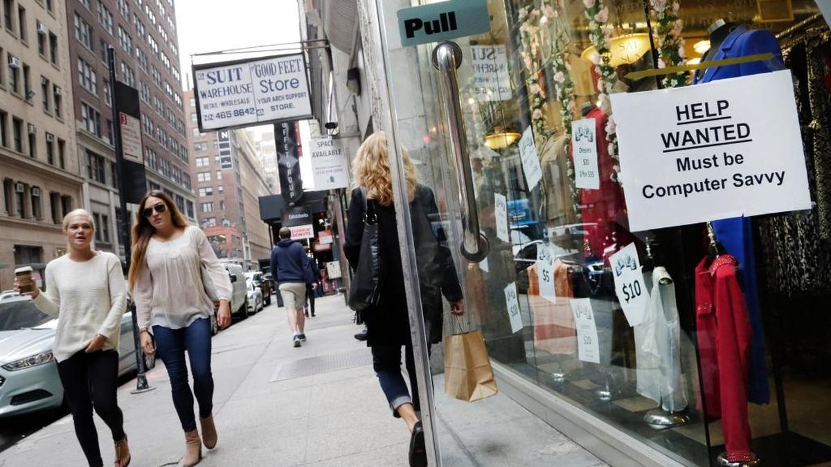 A ‘Help Wanted’ sign hangs in a store window in New York. In 2017, employers are likely to find it increasingly difficult to find qualified talent and are much more likely to have to pay more to attract, hire and retain employees, says middle-market business expert James Cassel.