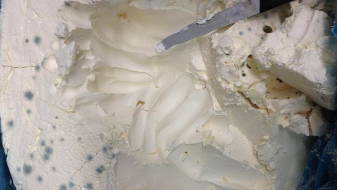 This photo of mold-covered cream cheese was submitted as part of a lawsuit against landmark Miami Cuban restaurant Versailles by a former employee.