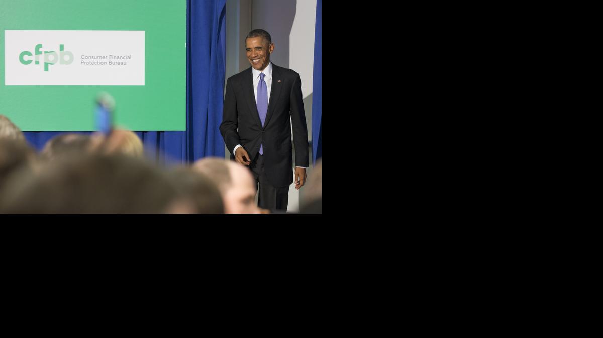 
President Barack Obama arrives to deliver remarks at the Consumer Financial Protection Bureau on Friday in Washington. Saying more must be done to stop data breaches affecting consumers, President Barack Obama announced Friday a government plan to tighten security for the debit cards that transmit federal benefits like Social Security to millions of Americans. 
