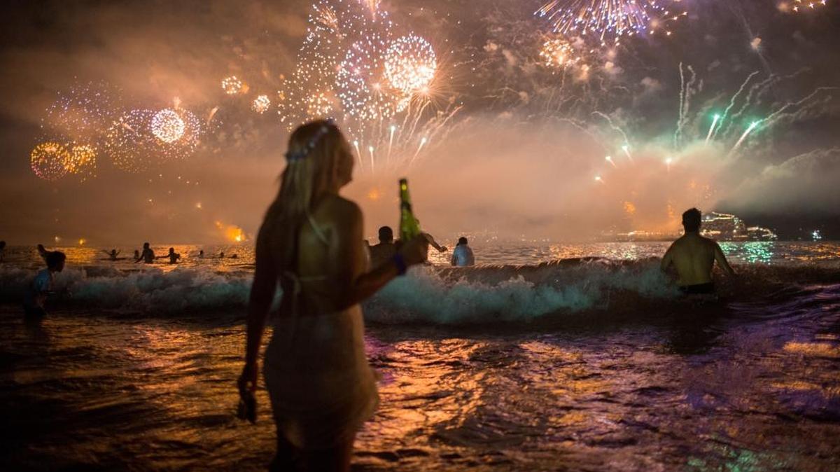 Fireworks light the sky over Copacabana beach during New Year's Eve celebrations in Rio de Janeiro. There’s a gloomy economic forecast for Brazil in 2016.