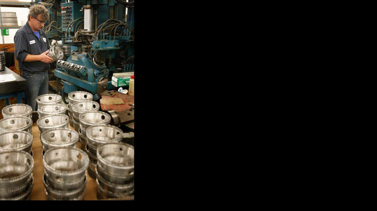 
HEICO, a high-tech manufacturer that produces and sells thousands of precision, FAA-approved replacement parts for the world's biggest airlines. Among the parts they make are jet engine combustion chambers, jet turbine blades, bearings, rings and landing gear parts. In this file photo, Vladimir Macko checks the resistance weld as it leaves the welding machine.
