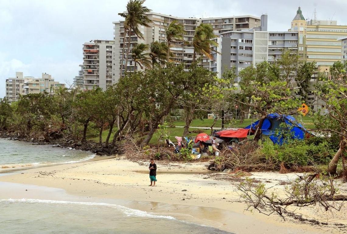 Israel Vila walks along the shore in San Juan, Puerto Rico on Tuesday, October 17, 2017 after Hurricane Maria struck the island. Since, the island has reopened to visitors and much of the damage has been cleared.