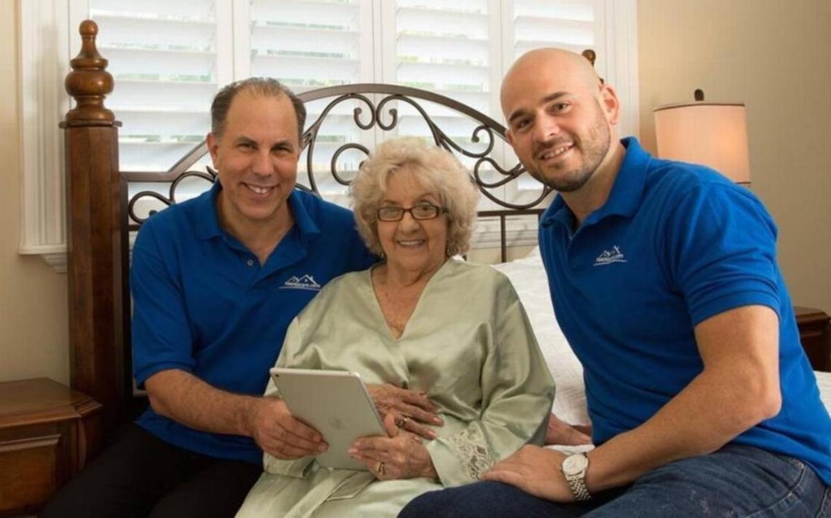 Room2Care founders Todd Florin, left, and Richard Ashenoff launched a senior home-care service that leverages the sharing economy. They are shown here with a customer, Edith Leake, in 2015.