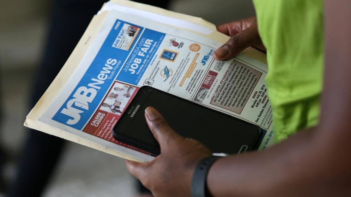 A job applicant attends a job fair in Miami Lakes in July.