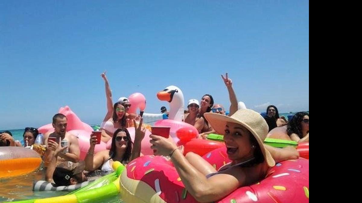 
A group of new friends lounge in the water in their floats during Floatopia, a massive float party, which was held in Miami Beach in April.
