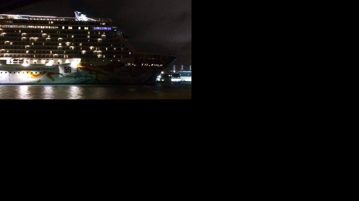 
The Norwegian Getaway is shown sailing toward PortMiami’s turning basin late Saturday night after getting Coast Guard clearance to depart.
