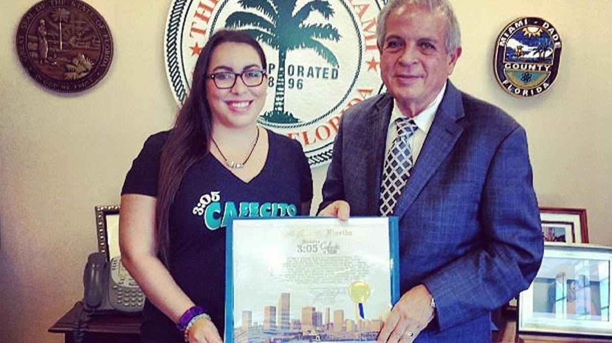 JennyLee Molina stands with Miami Mayor Tomás Regalado after he proclaimed 3:05 p.m. Miami’s official coffee hour.
