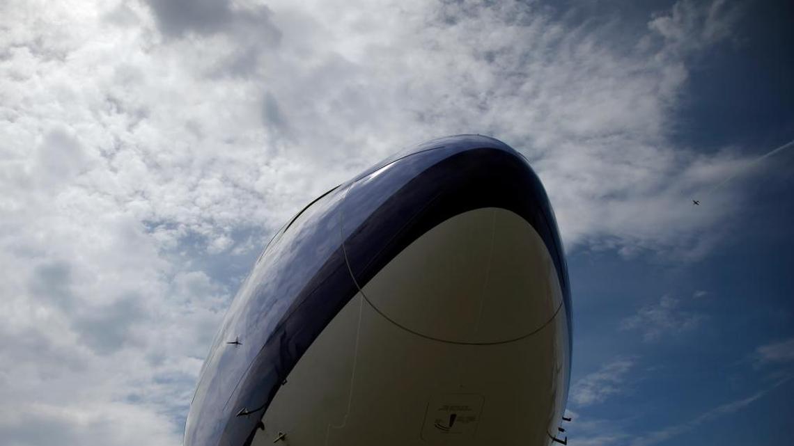 The nose of a Boeing 777-300 of China Airlines is silhouetted in the sky at the Paris Air Show, June 16, 2015.