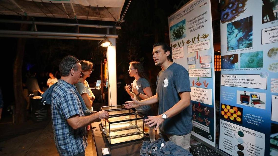 Andrew C. Baker, Associate Professor, Department of Marine Biology and Ecology alongside Ph.D. candidate Rivah Winter,(right) both from the University of Miami, speak with Eldredge Bermingham and Chimene Longwater, (left) they are finalists for the CappSci Inventors Prize with their proposal "Stress Hardening Corals'' during "Nerd Nite" at Gramp's in Wynwood on Thursday. On Friday night, they were selected the winners and they will be creating their innovation at the Patricia and Phillip Frost Museum of Science for a year, as well as receiving $100,000 to fund their work, plus mentorship and support.