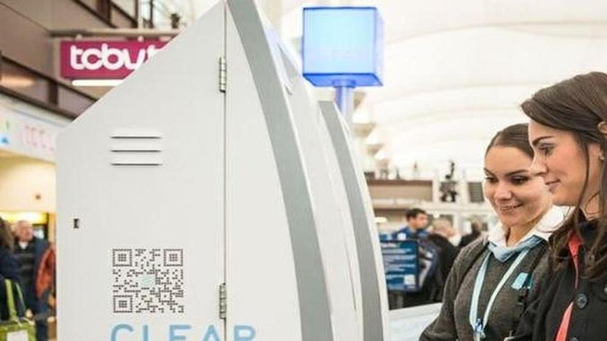
A traveler is assisted by a CLEAR representative at a CLEAR biometric kiosk at a participating U.S. airport.



