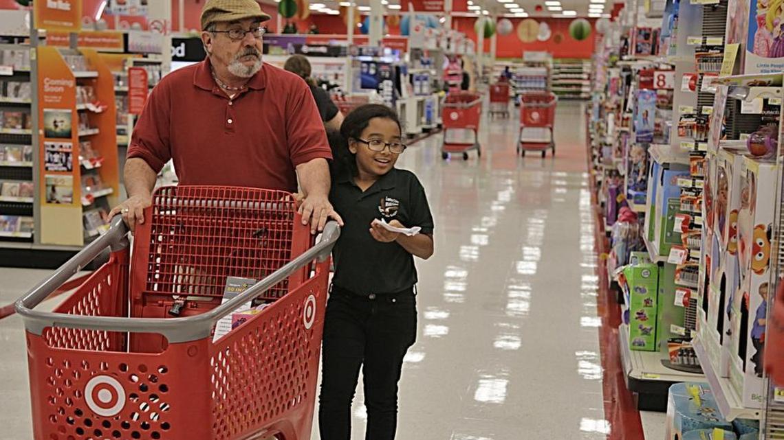 Shopping trips like this father-daughter one to a North Miami Target, might become less necessary with Target and Shipt’s partnership.