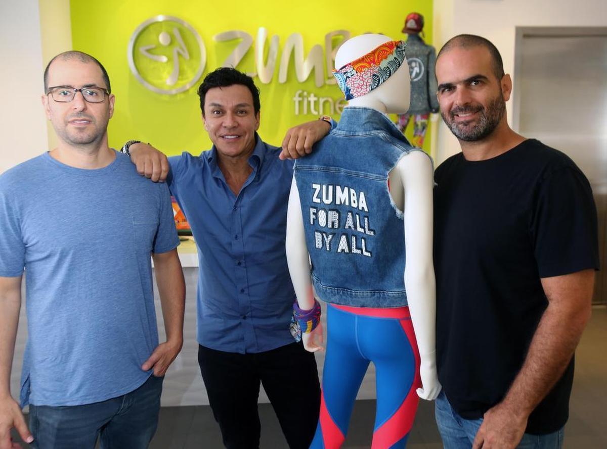 From left: Alberto Perlman, Alberto “Beto” Perez and Alberto Aghion, co-founders of Zumba Fitness, at Zumba headquarters in Hallandale Beach on Aug. 17.