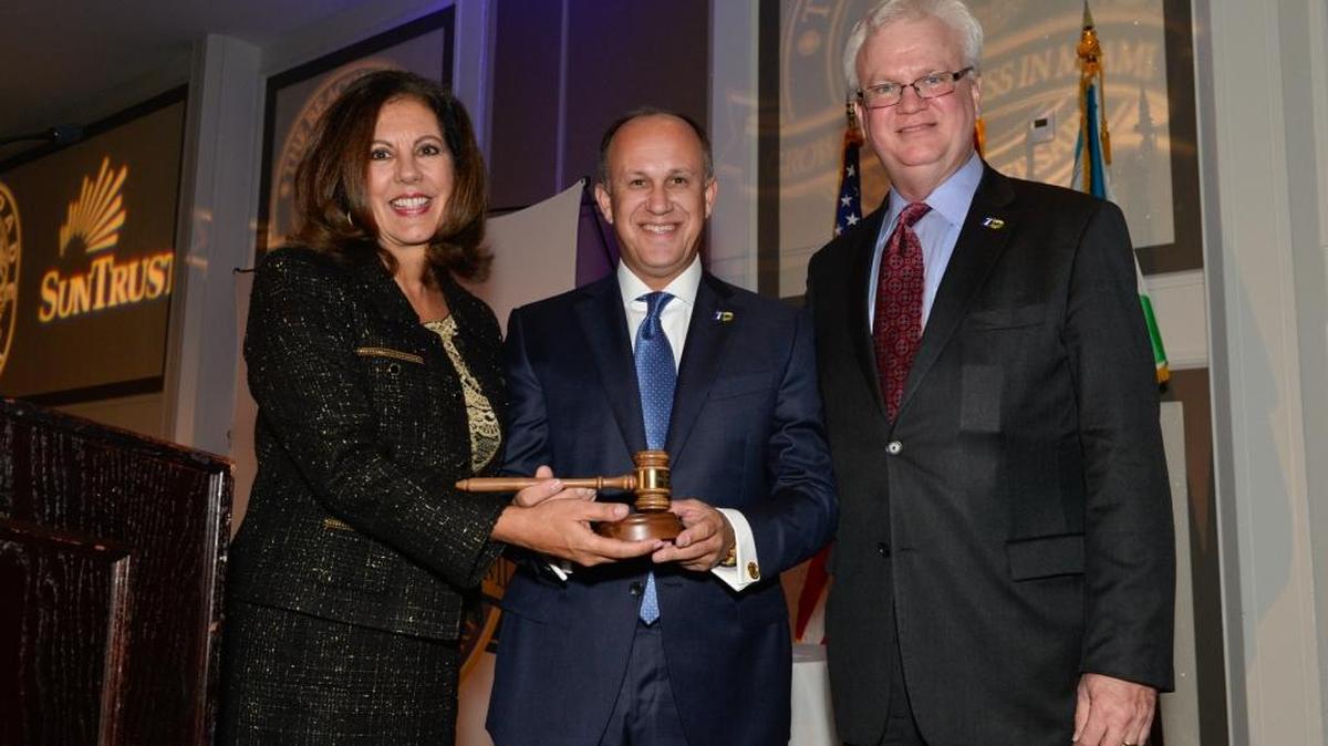 Outgoing Beacon Council chairwoman Donna Abood (left), incoming chairman Ernie Diaz (center), and Beacon Council president and CEO Larry Williams (right) at the public-private organization’s 30th anniversary celebration, held Wednesday, Oct. 21.