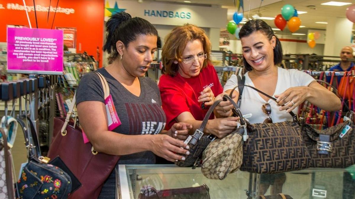 Sara Velez and Melinda Velez shop for purses at the grand opening of the first Macy’s Backstage The Outlet Store in Florida at Macy’s Boynton Beach Mall on April 29, 2017.