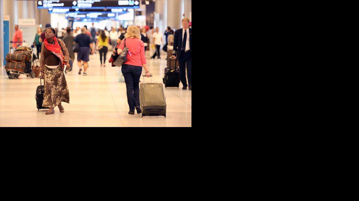 
Passengers looking for their flights at Miami International Airport on Wednesday, November 26, 2014, a day before Thanksgiving.
