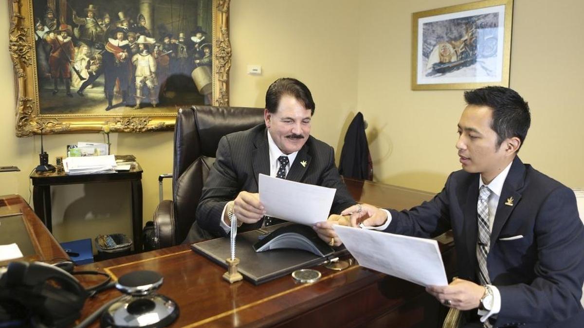 BioTrackTHC co-founder and chairman emeritus Steven Siegel, left, and CEO Patrick Vo confer in Fort Lauderdale. The company develops and sells marijuana inventory tracking software for government agencies and authorized businesses.