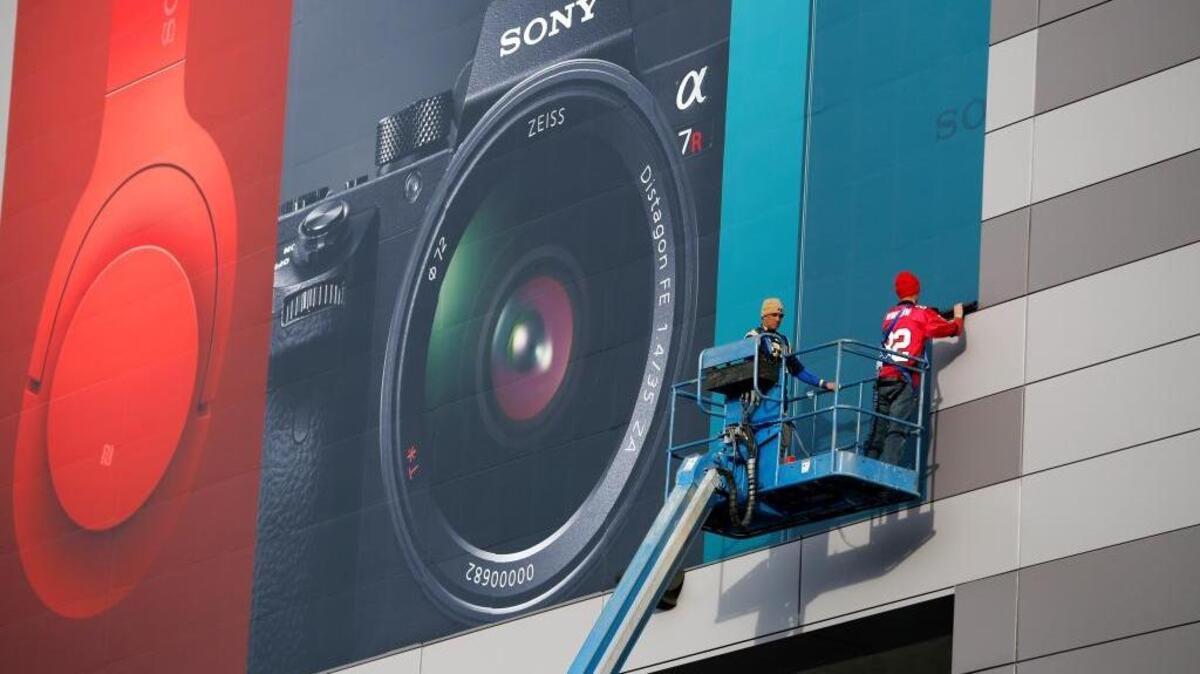 Workers install a sign for Sony products in preparation for the International CES gadget show Sunday, Jan. 3, 2016, in Las Vegas. The show officially kicks off Wednesday, Jan. 6.