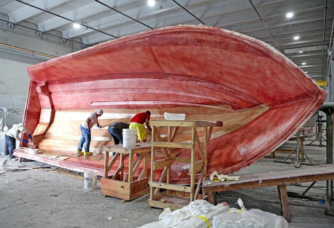 A hull is prepared at the SeaHunter factory in Princeton. The company makes boats from 28 feet to 45 feet, with prices ranging from $180,000 upward. SeaHunter vessels will be on display at the Miami International Boat Show.