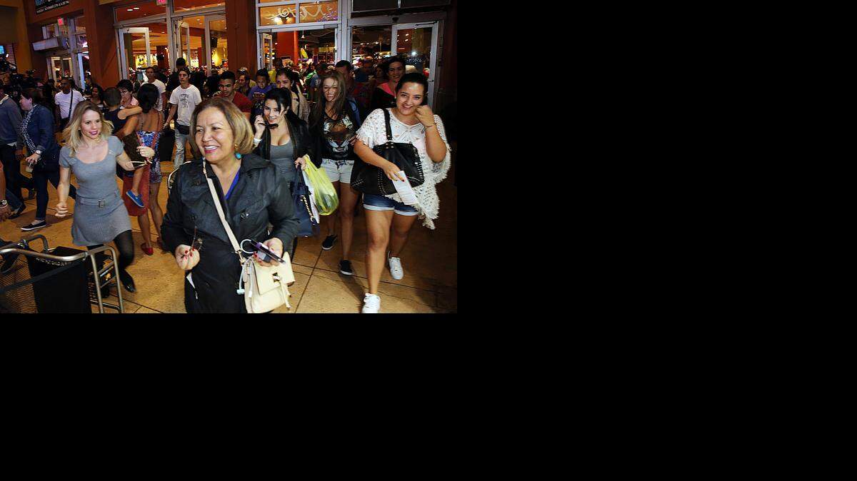
After waiting in line patiently for hours, hundreds of early birds rush in as the Dolphin Mall opens its doors to shoppers at 6 p.m. on Thanksgiving.


