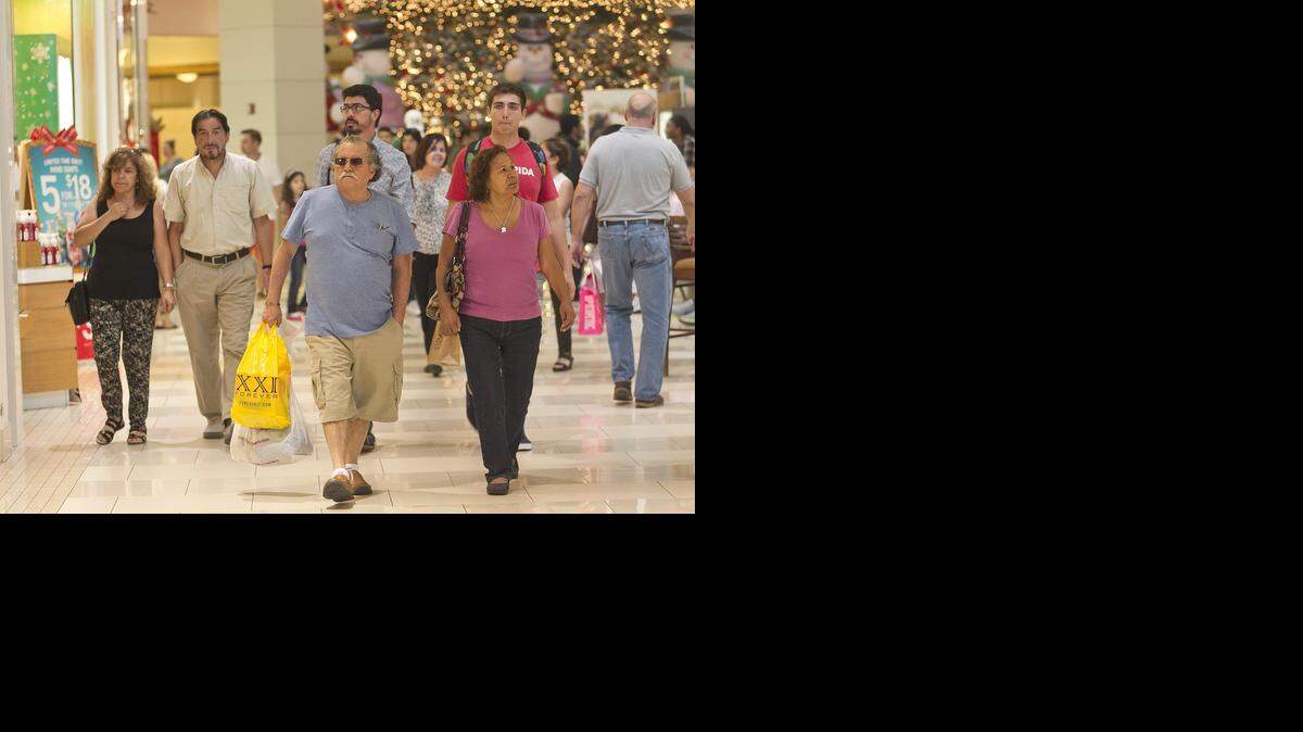 
Shoppers begin their holiday shopping early at Aventura Mall on Monday, Nov. 24, 2014.

