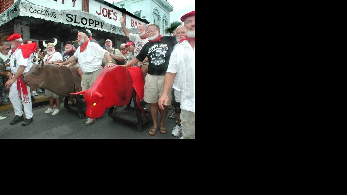
Ernest Hemingway Look-a-likes parade down Duval Street during Key West's version of the "Running of the Bulls" at the 2001 Hemingway Days Festival. The Keys tourism bureau plans to use Hemingway to promote Key West as a destination for Cuba vacations once the United States lifts tourism restrictions on the island. 
