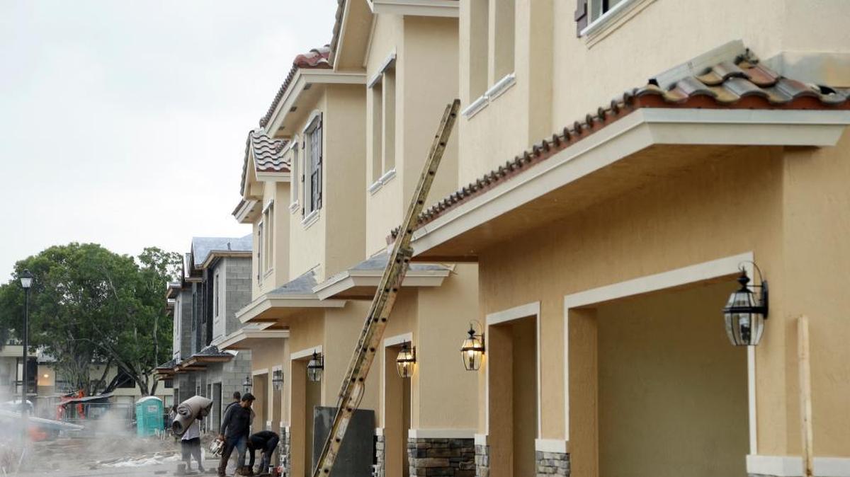 In this Thursday, Sept. 22, 2016, file photo, Lennar Corporation town homes are under construction at Chelsea Place in Tamarac,