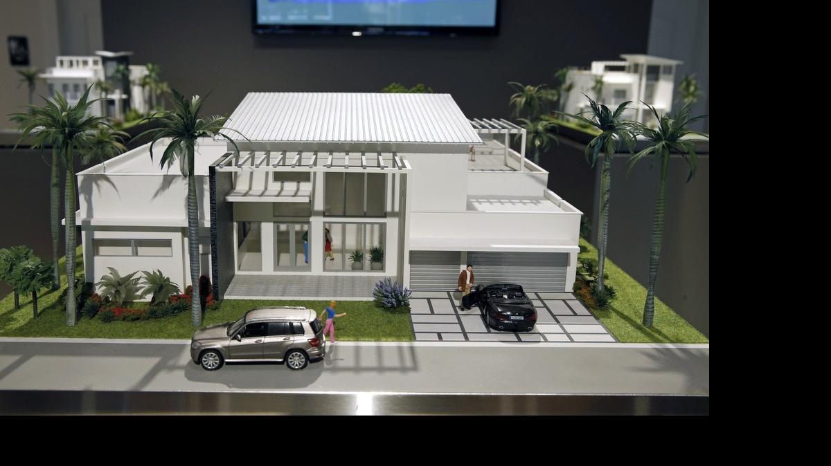 
A model of an Oasis Park Square single-family home at the project’s sales center in Doral.
